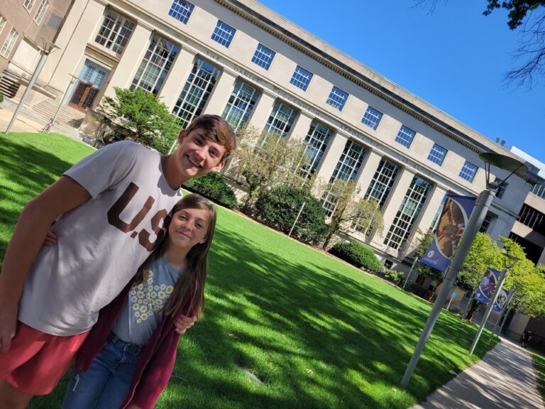 Alex and Katie standing on the MIT campus during a college visit, symbolizing the rewards of intentional, educationally focused parenting.
