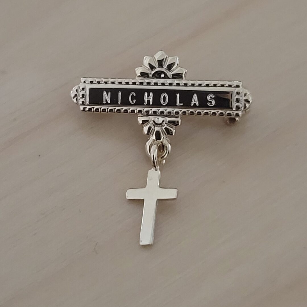 Gold cross baptismal christening pin for baby.